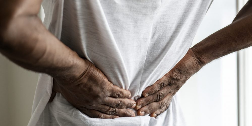 Black man suffering back pain